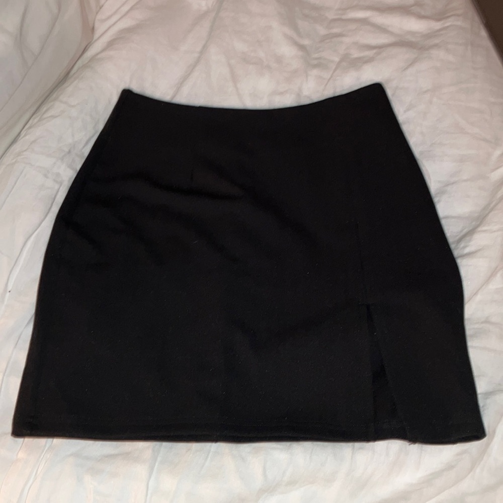 Black mini skirt with slit